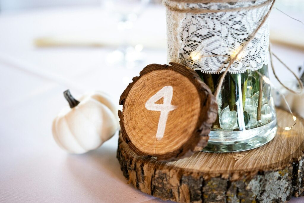 a wooden slice with a number on it sitting on a table