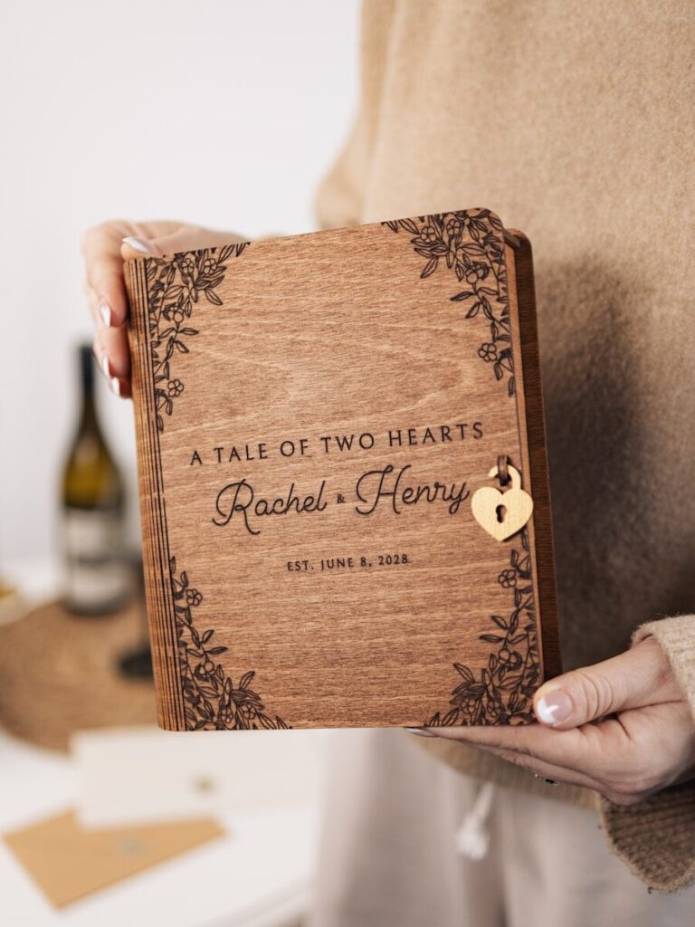Photo by Anna Blake A person holding a book with a heart on it